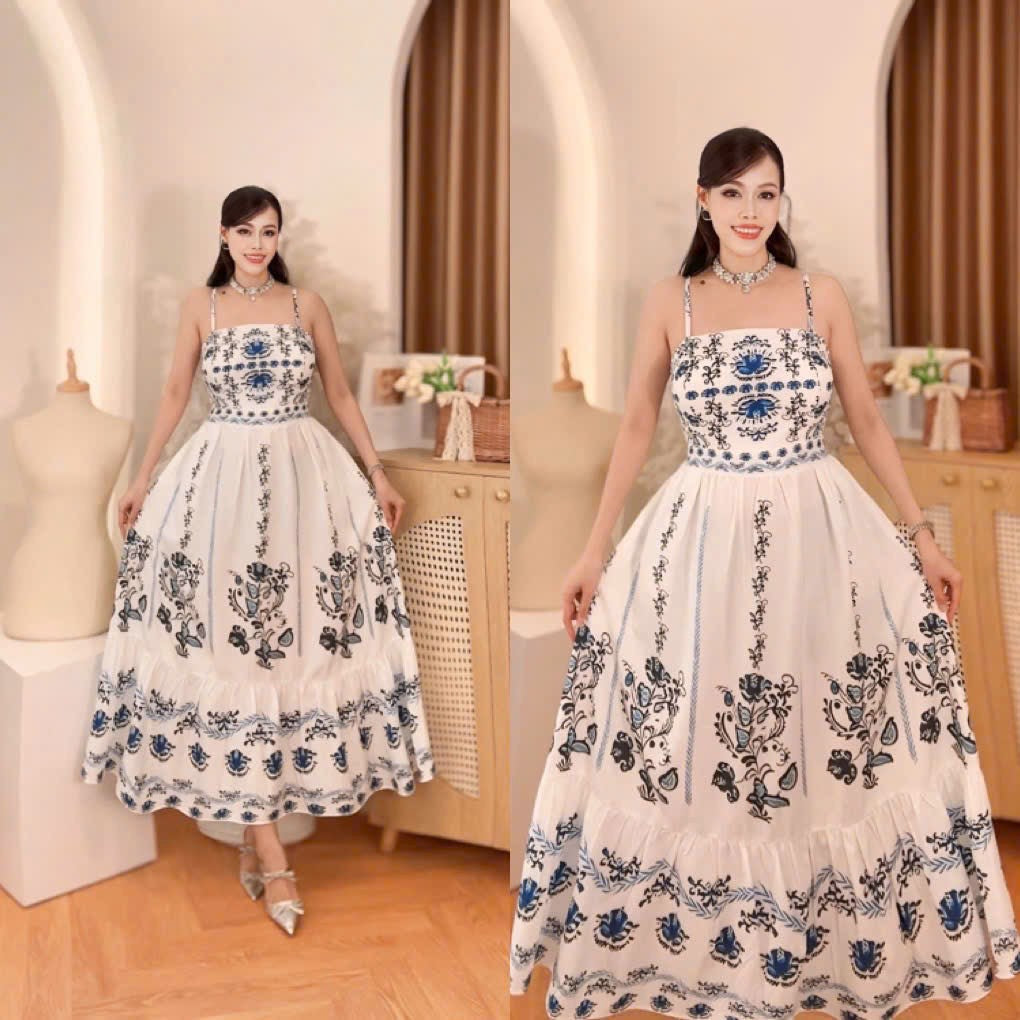 Blue and White Porcelain Print Maxi Dress on display, featuring floral embroidery and a flared skirt design.