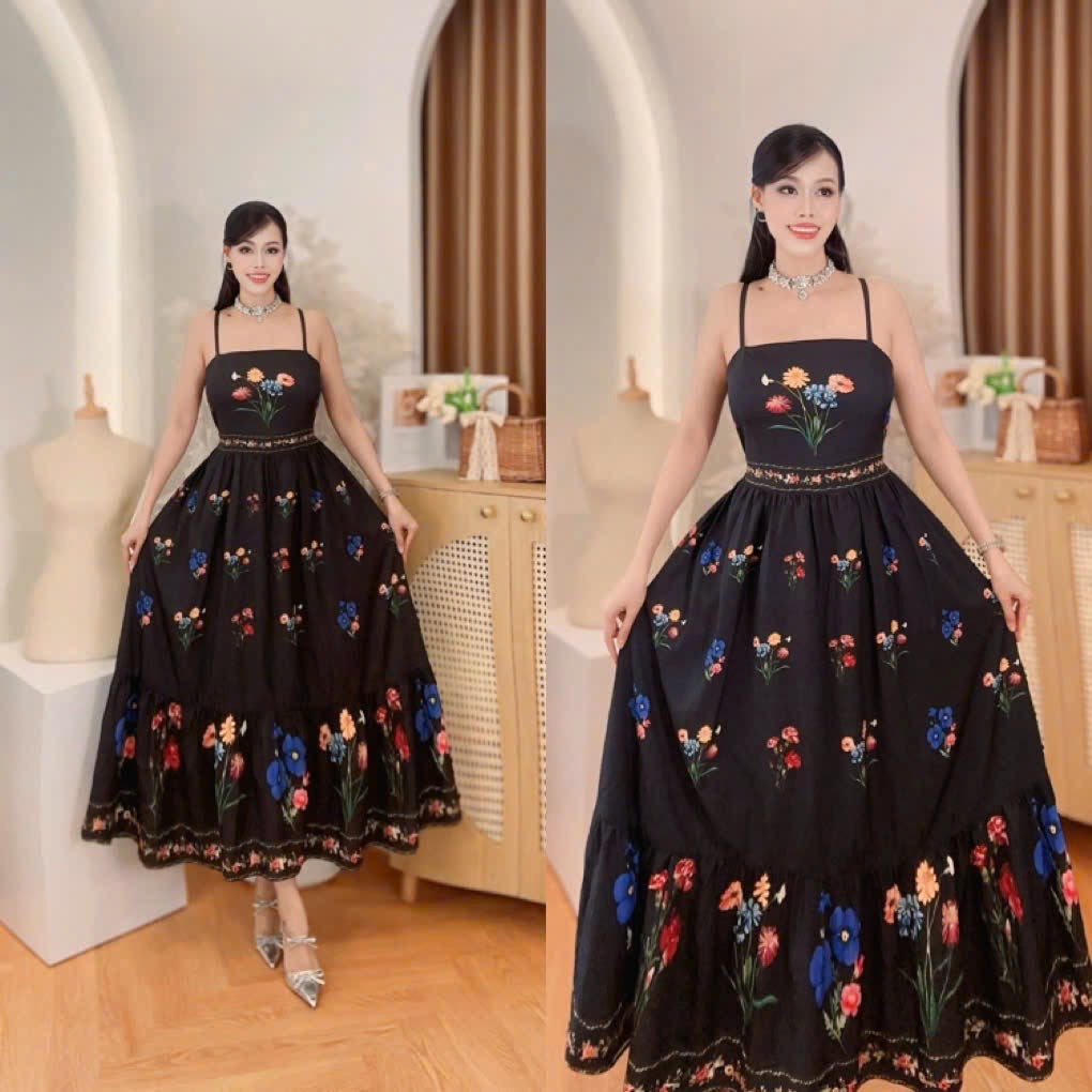 Vietnam Bohemian Black Spaghetti Strap Tiered Maxi Dress displayed in an elegant setting, featuring floral designs and a flowing silhouette.
