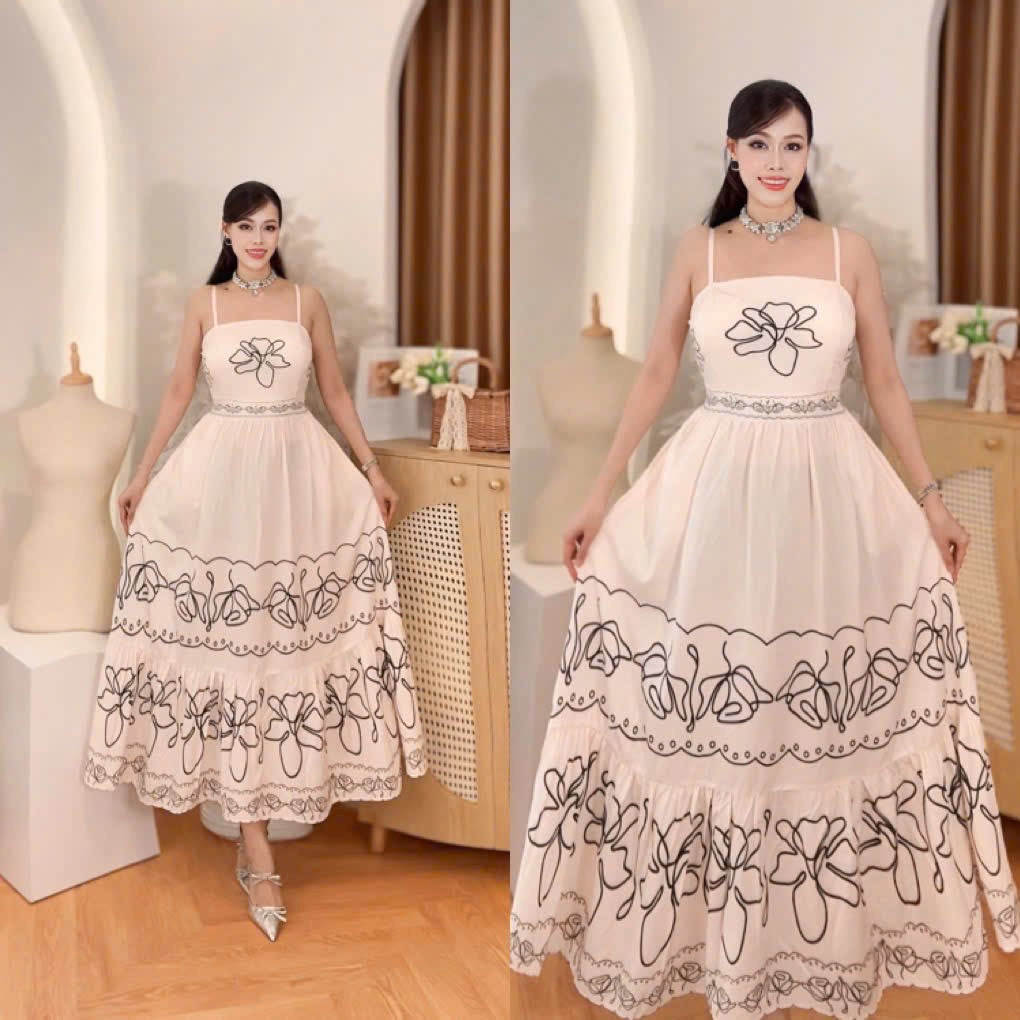 Vietnam Luxury Cream & Black Floral Tiered Maxi Dress showcased on a model, highlighting its elegant design and flowy fabric.