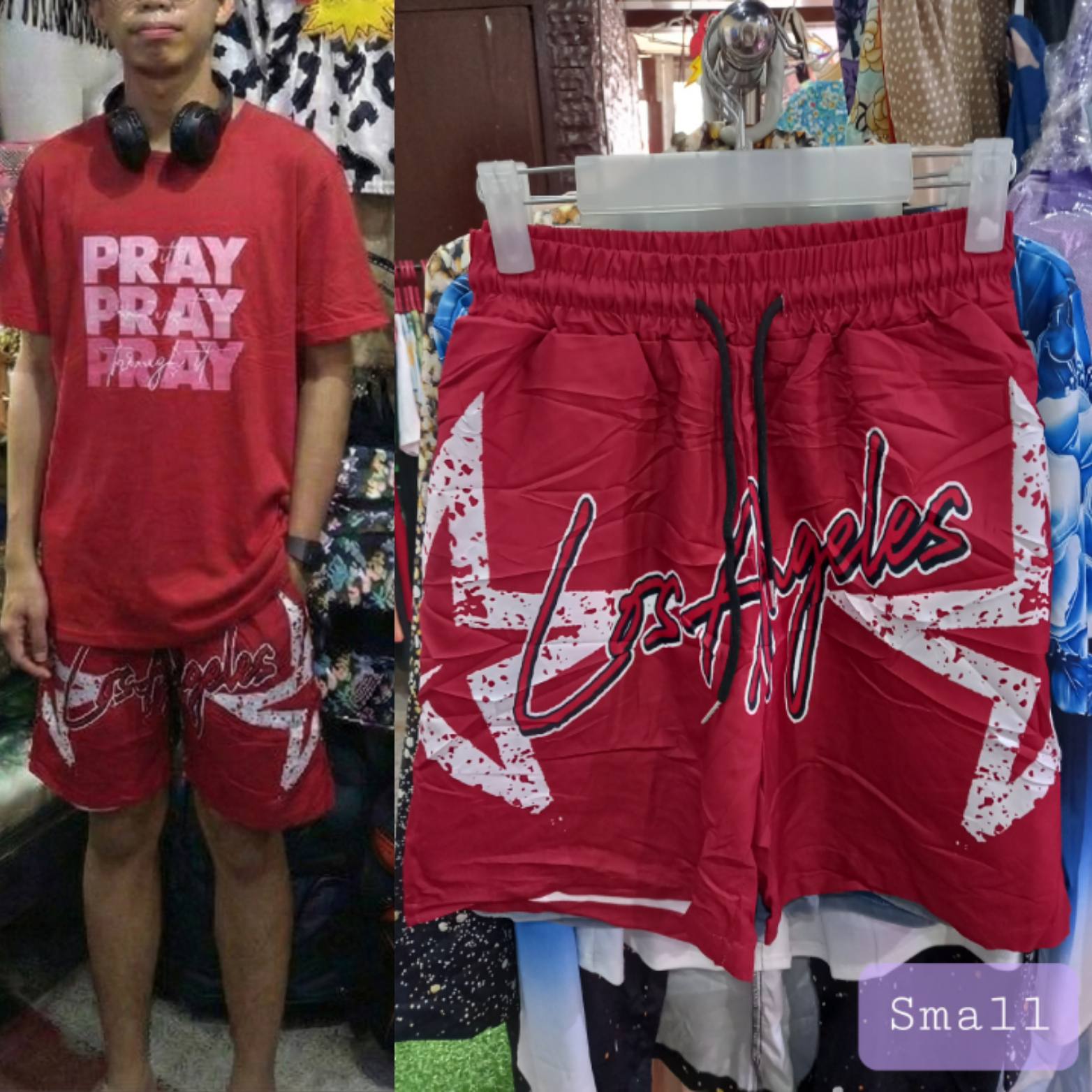 Split image displaying Men Red Distressed Los Angeles Small Graphic Shorts. The left side shows a model wearing the shorts featuring white "Los Angeles" script and a printed distressed effect, paired with a dark t-shirt. The right side shows a close-up of the shorts hanging on a rack, highlighting the elastic waistband, drawstring, and fade details.