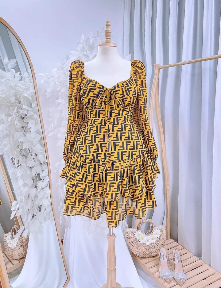 Vietnam Logo Print Chiffon Mini Dress featuring a vibrant yellow and black monogram pattern.